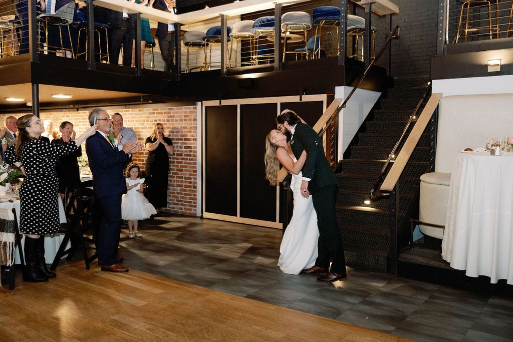 Bride and groom enter their wedding reception at the rose event venue in golden colorado