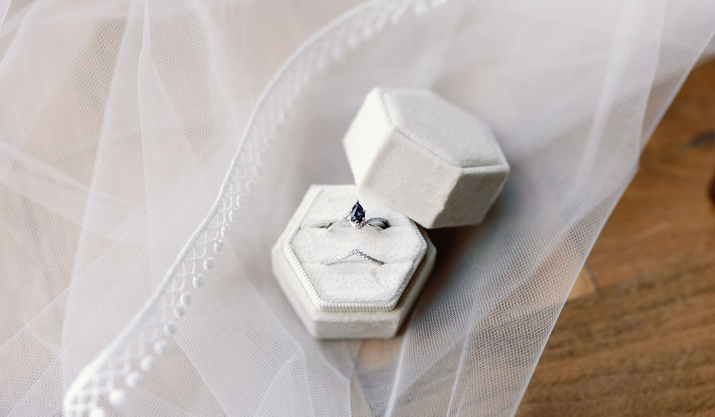 Bridal details and wedding ring lay flat