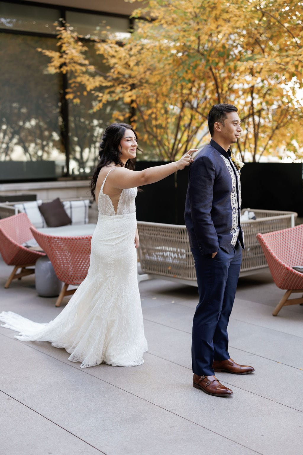 Bride and Groom First Look at Limelight hotel in downtown denver on their patio overlooking union station