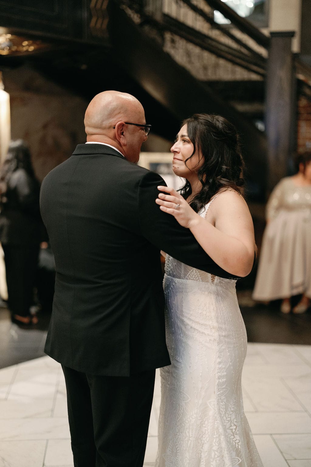 Daughter cries during her Father Daughter First Dance at Ironworks Wedding in Denver, Colorado 