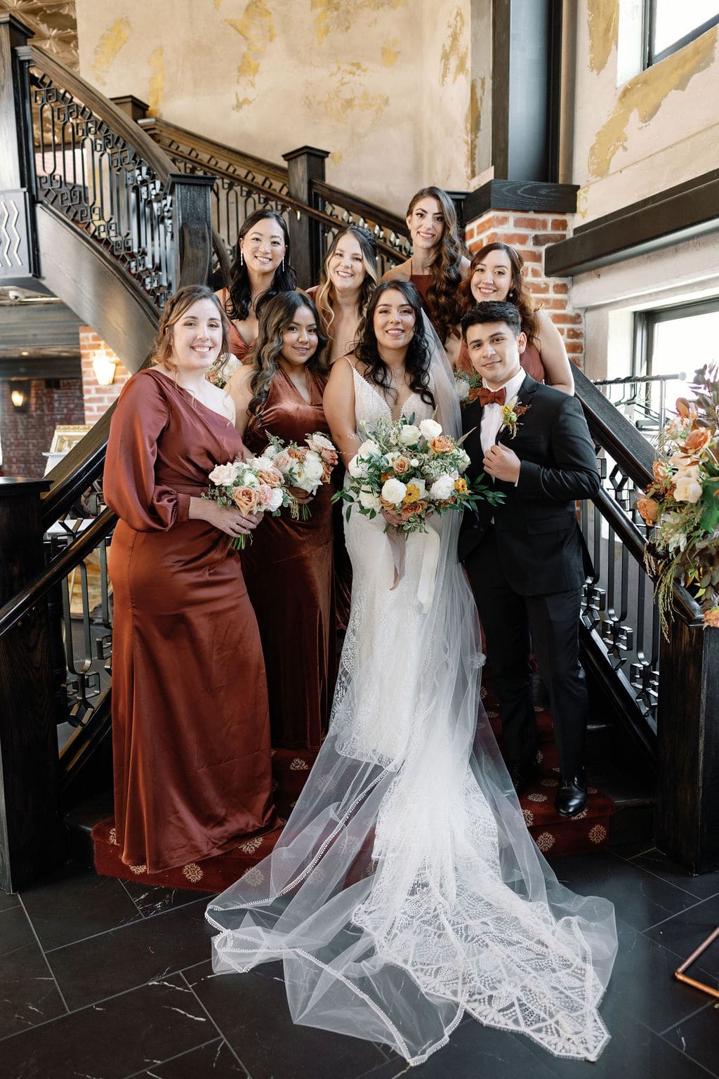 Bridesmaid photos on the stairs at Ironworks in denver