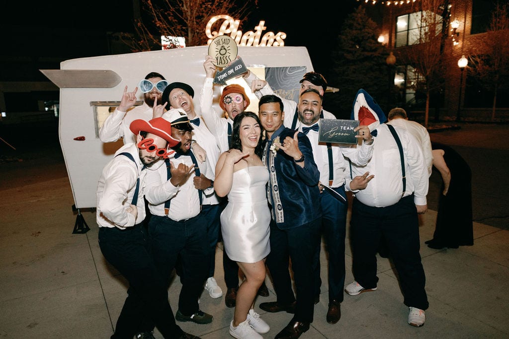 photobooth at ironworks wedding reception with wedding party posing in front