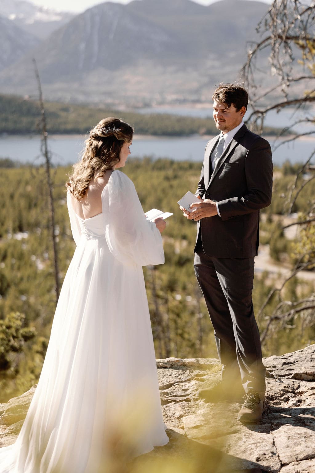 Couple says vows to each other at an overlook near Breckenridge Colorado 