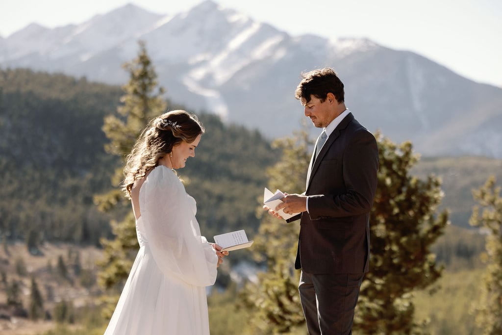 Couple says vows to each other at an overlook near Breckenridge Colorado 