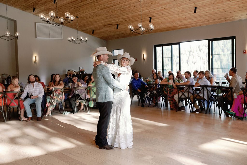 Couples first dance at their mountain view ranch lakeview wedding