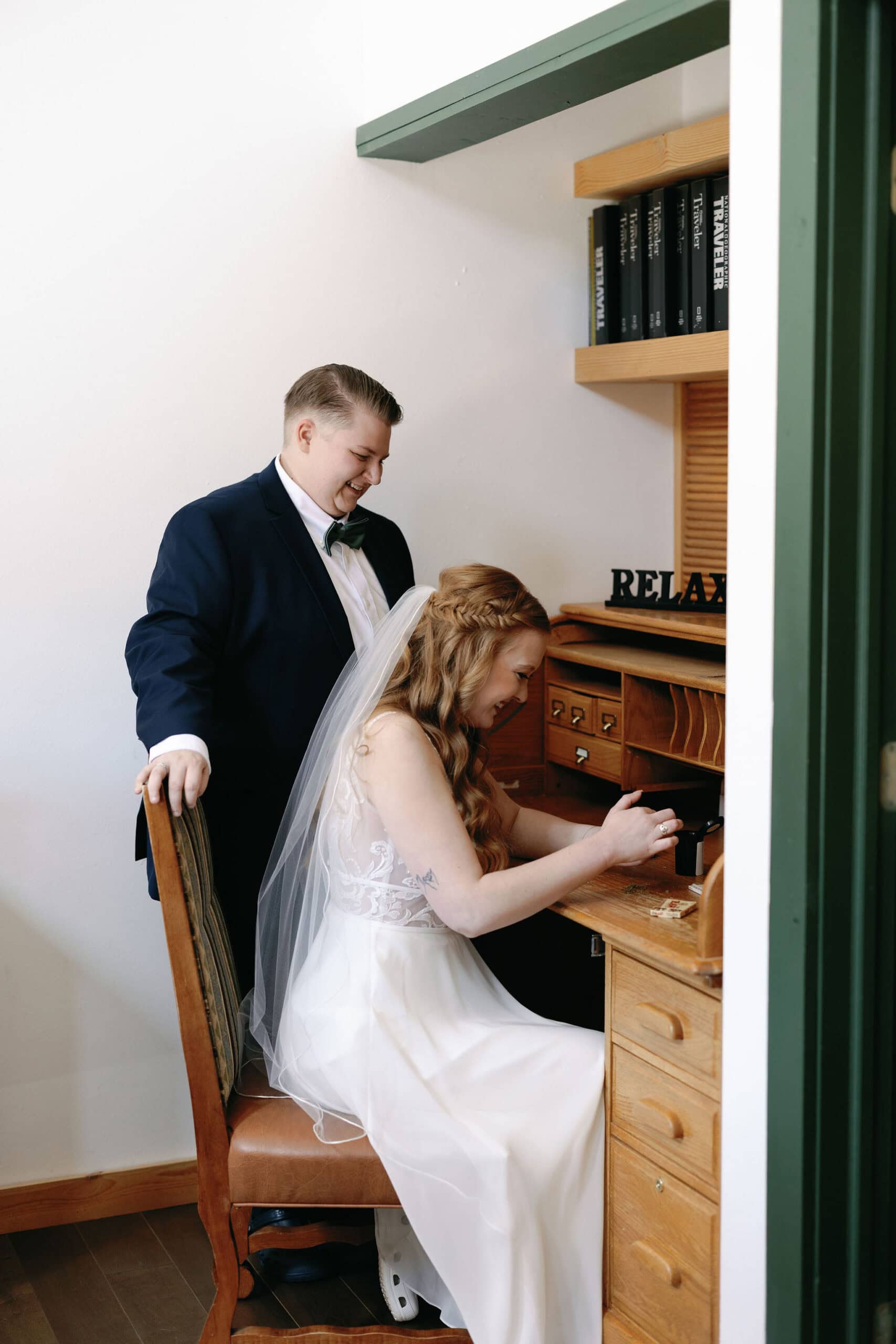 420 friendly wedding day in estes park colorado. LGBTQ couple rolls a joint to smoke before their wedding
