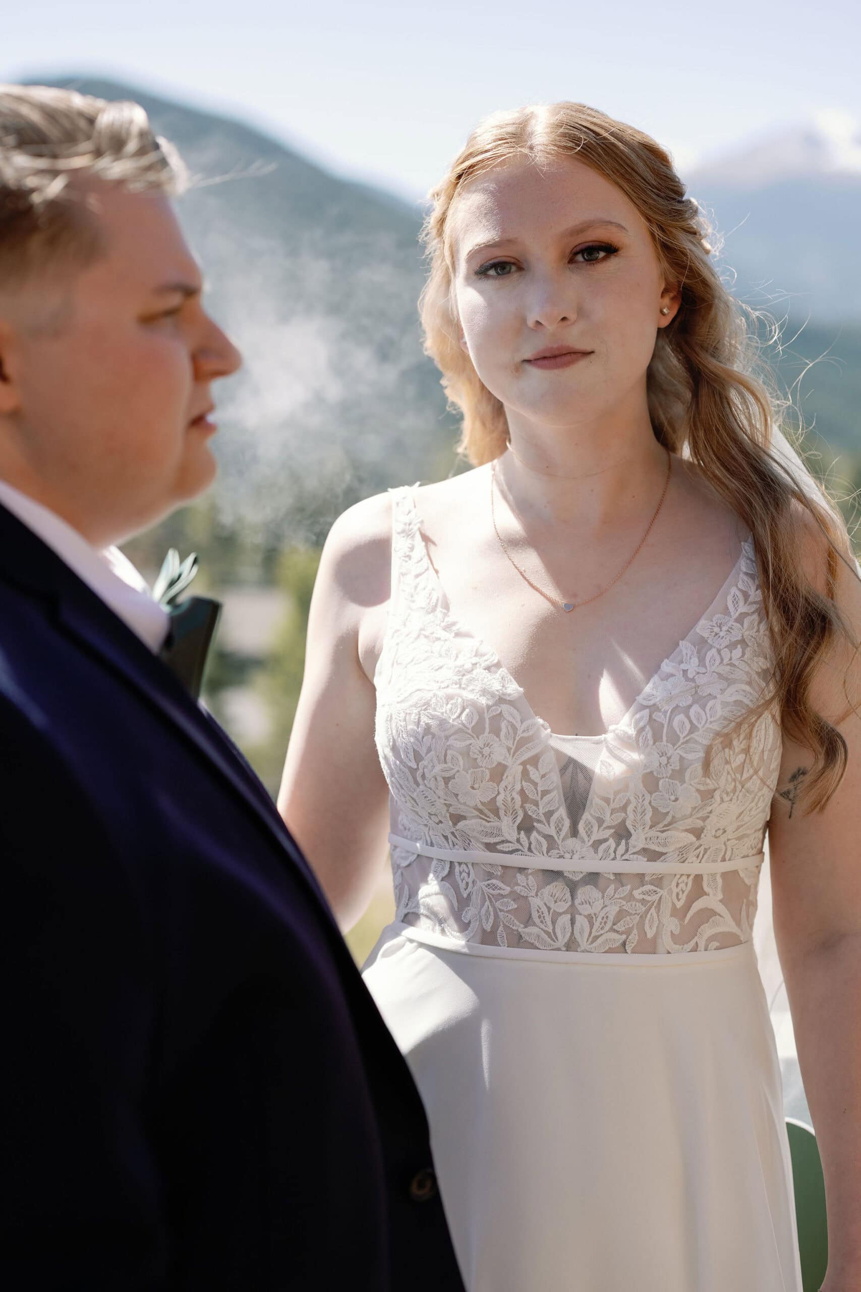 lgbtq couple shares a joint before they get married in estes park colorado during their cannabis friendly colorado wedding