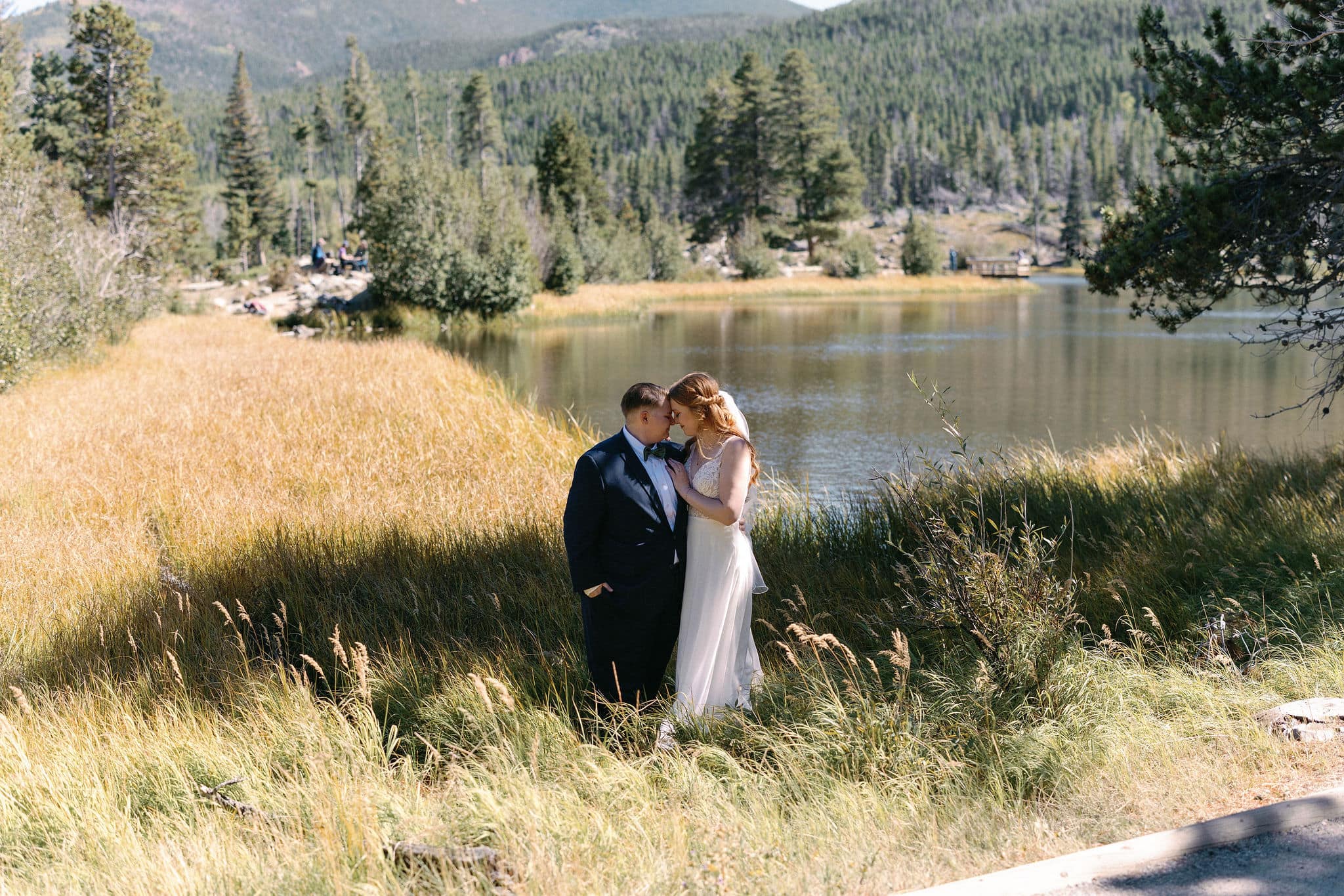 Bride and Bride portraits at Sprague Lake during a RMNP LGBTQ wedding in Estes Park on a gorgeous fall afternoon.