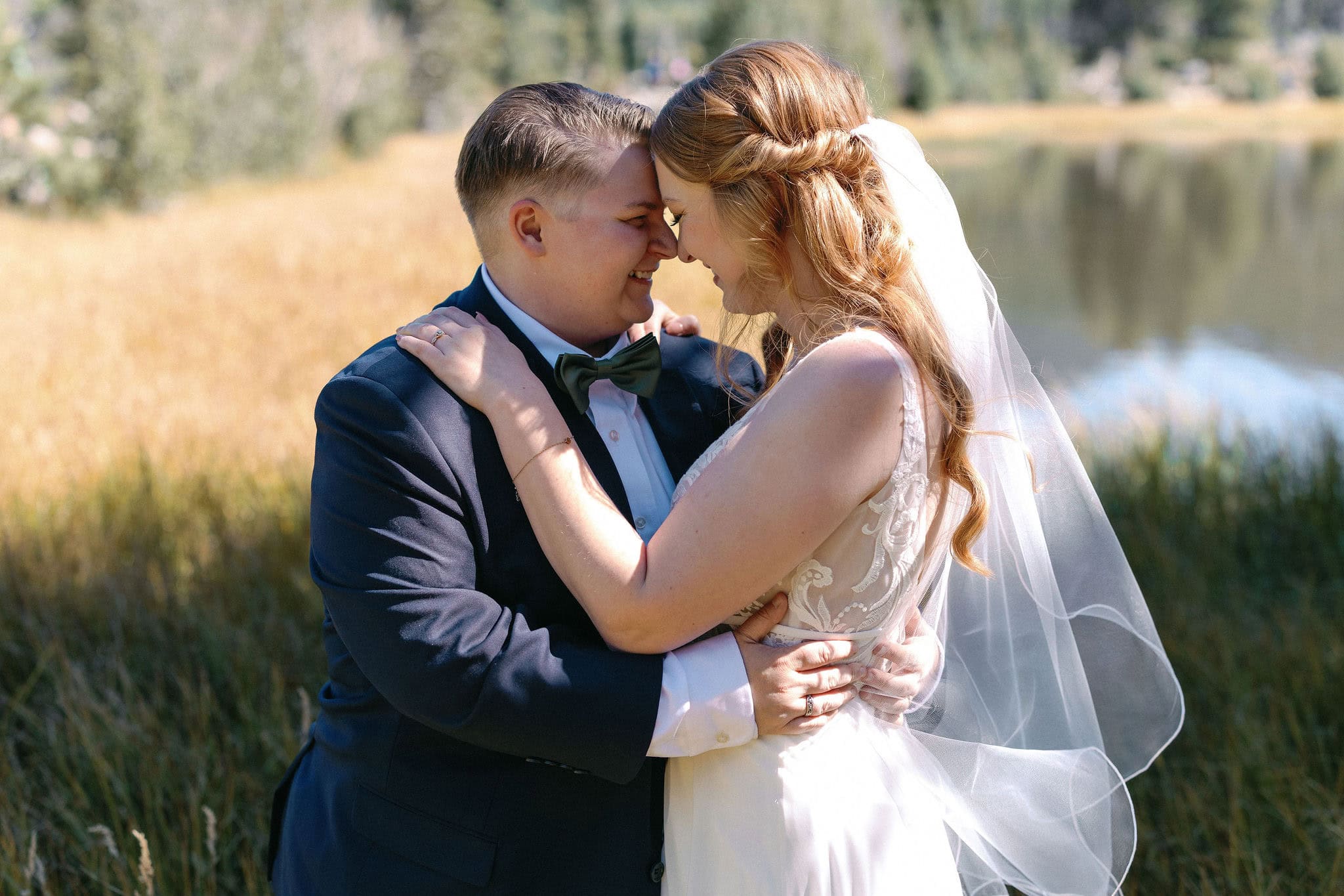 Bride and Bride portraits at Sprague Lake during a RMNP LGBTQ wedding in Estes Park on a gorgeous fall afternoon.