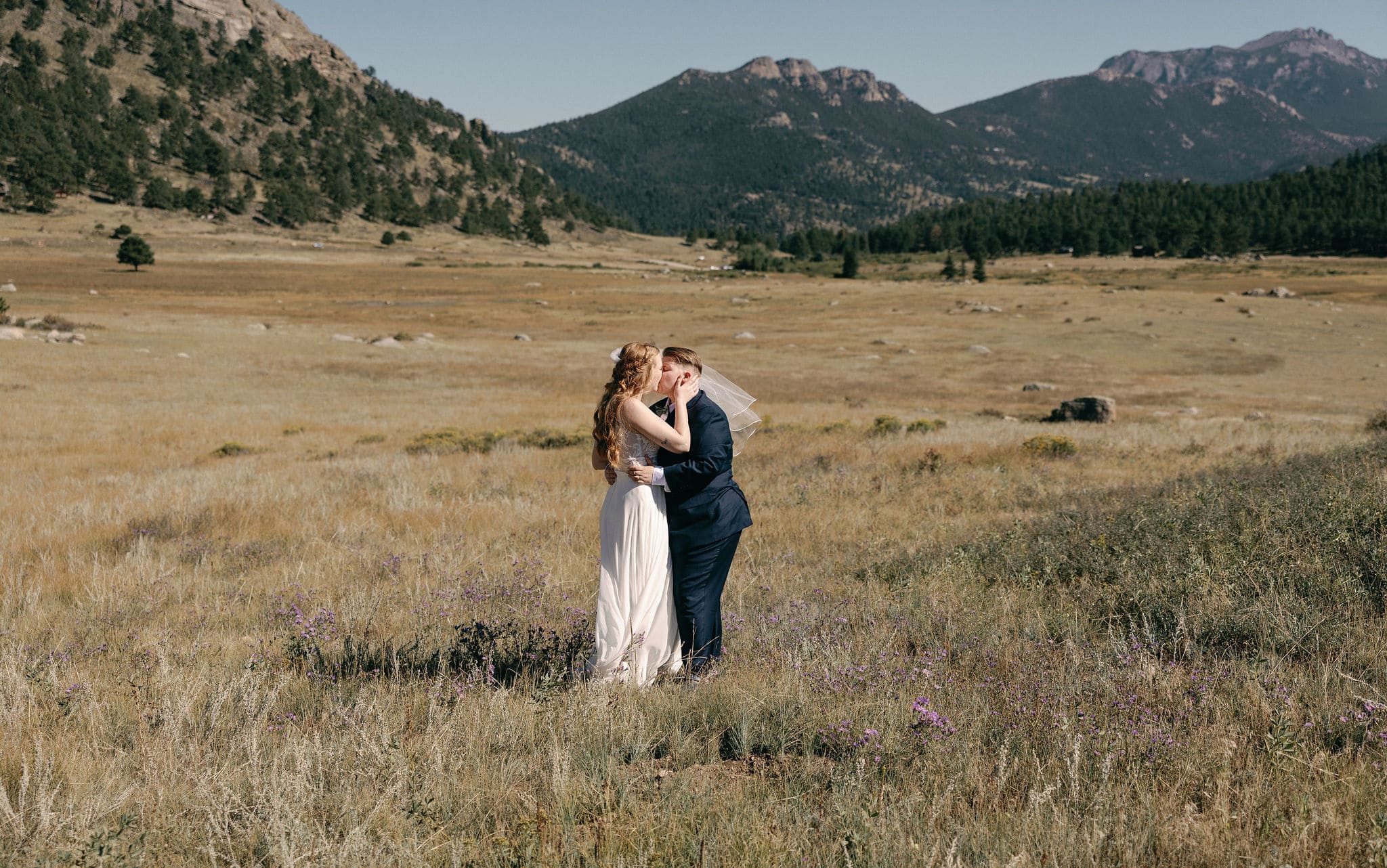 Gorgeous lgbtq couples portraits in estes park colorado. Rocky mountain national park wedding photography on a bright sunny day.