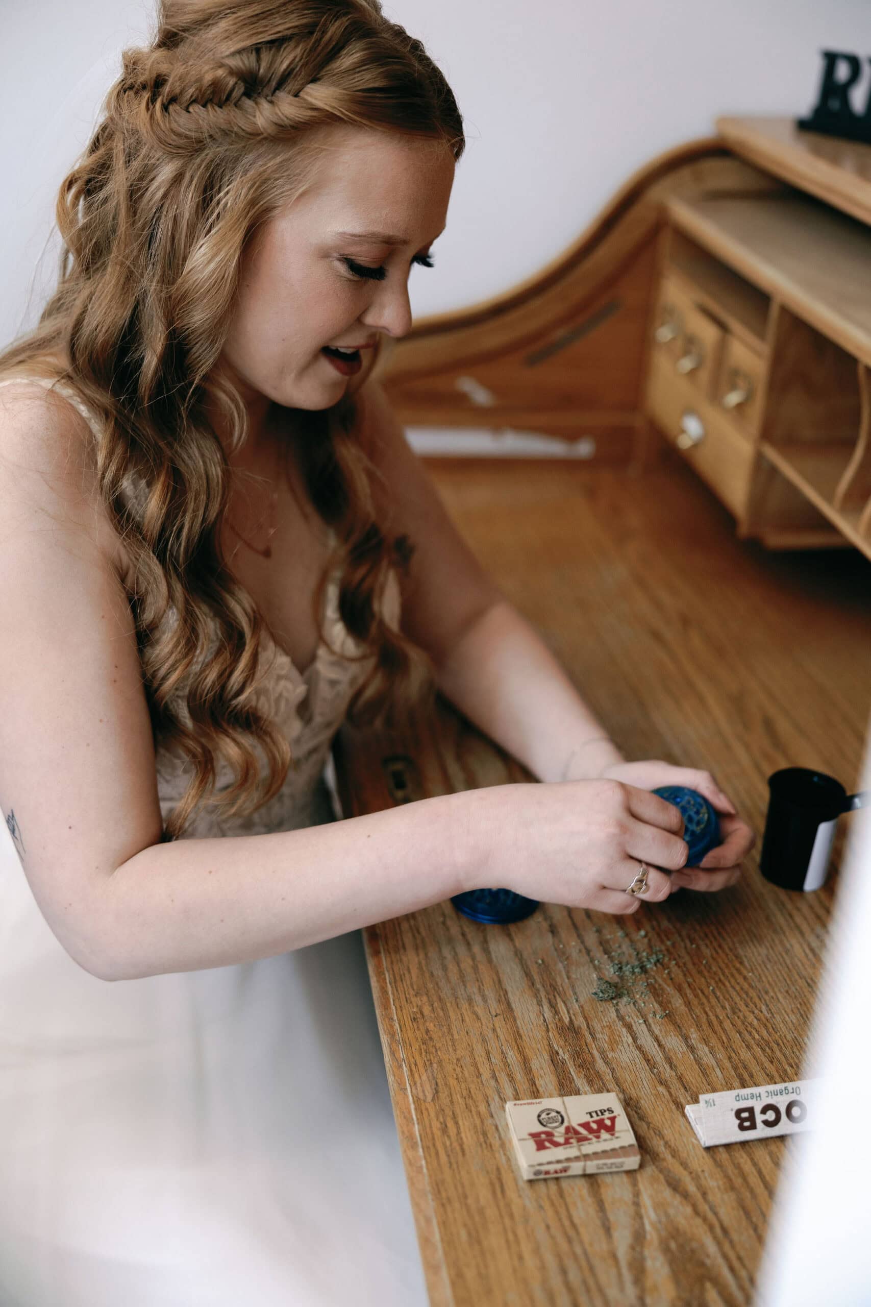 420 friendly wedding day in estes park colorado. LGBTQ couple rolls a joint to smoke before their wedding