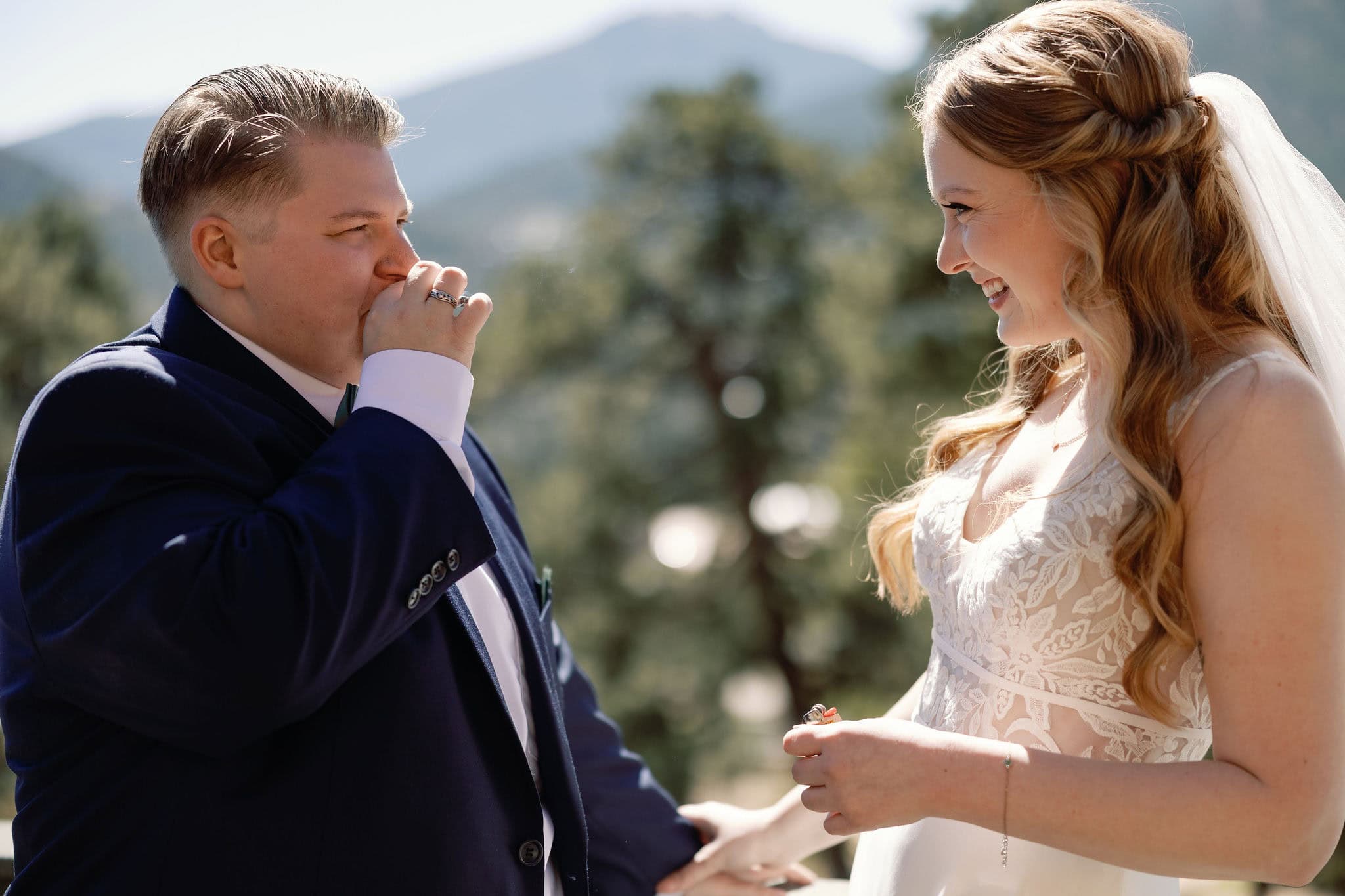 lgbtq couple shares a joint before they get married in estes park colorado during their cannabis friendly colorado wedding