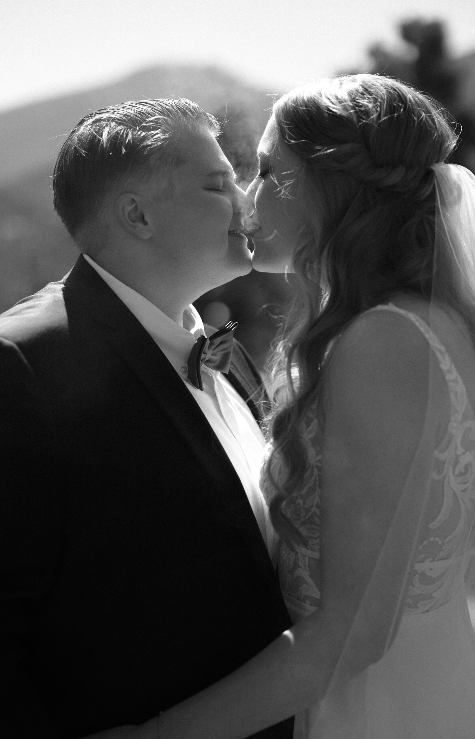 lgbtq couple shares a joint before they get married in estes park colorado during their cannabis friendly colorado wedding