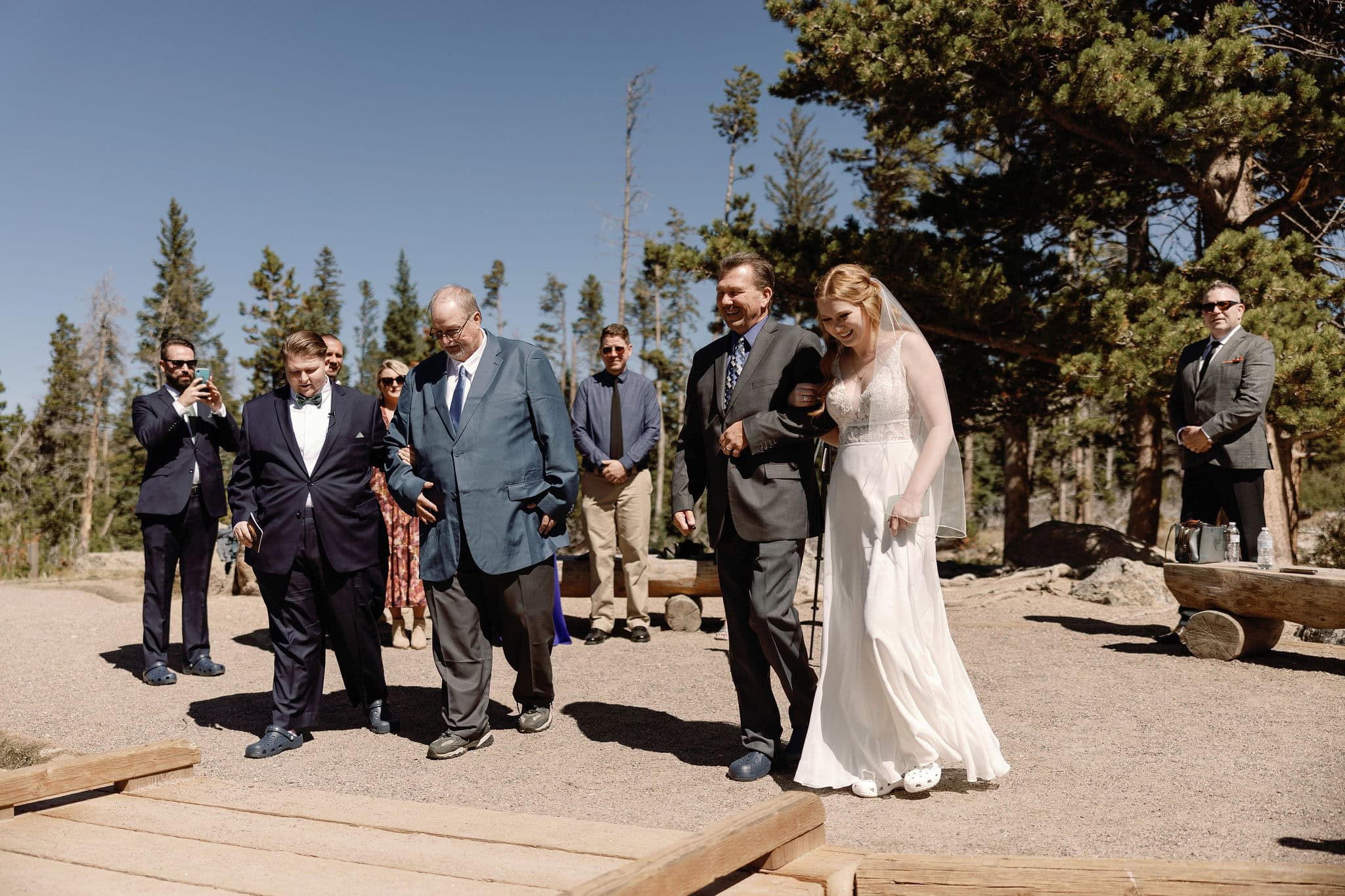 LGBTQ+ Wedding at Sprague Lake in Rocky Mountain National Park Colorado. Two Brides having a romantic lakeside Colorado wedding