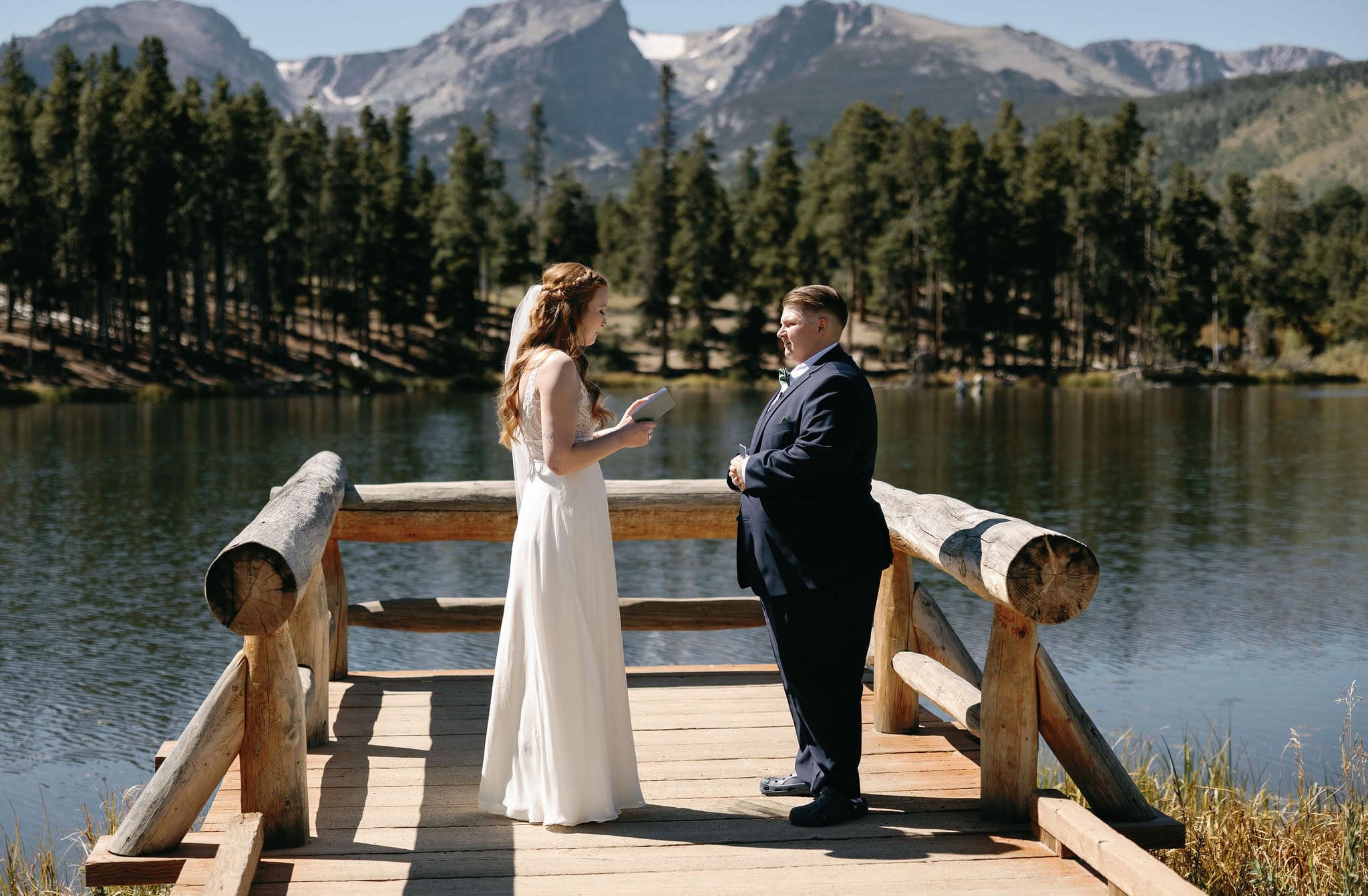 LGBTQ+ Wedding at Sprague Lake in Rocky Mountain National Park Colorado. Two Brides having a romantic lakeside Colorado wedding