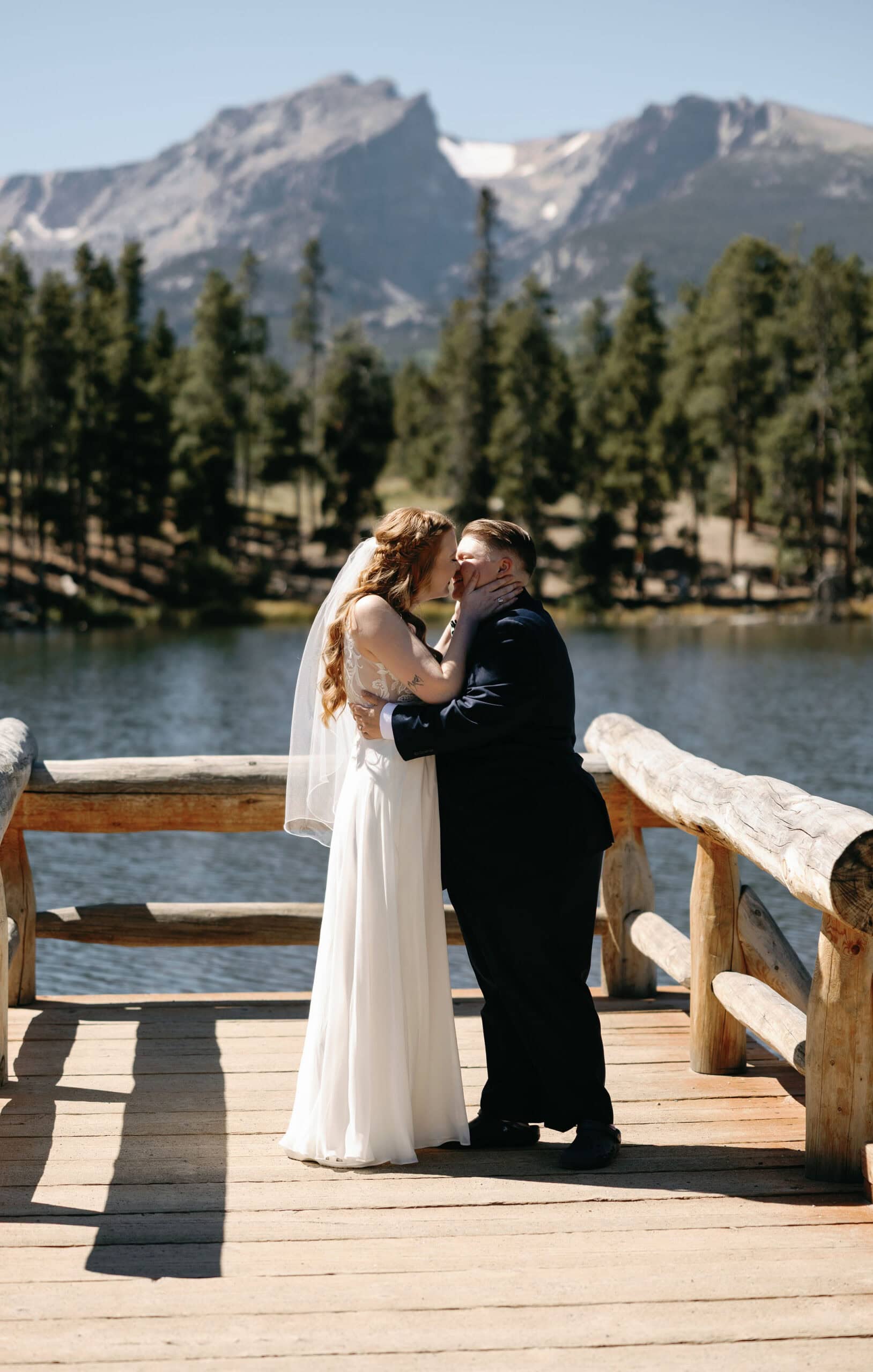 The Happiest moment as two brides take their first kiss at their sprague lake wedding in RMNP colorado