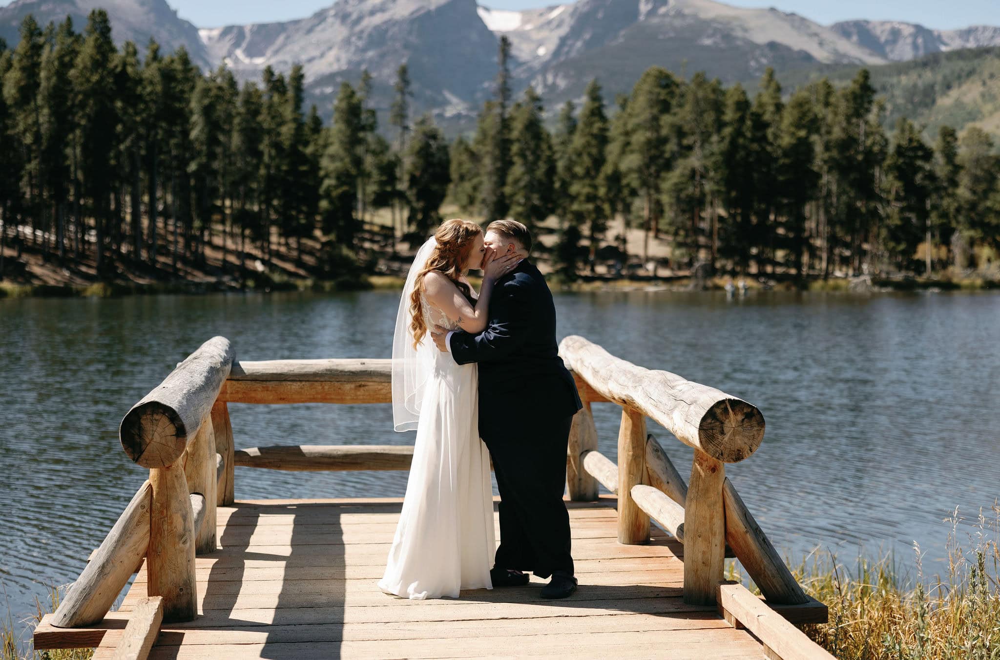 The Happiest moment as two brides take their first kiss at their sprague lake wedding in RMNP colorado