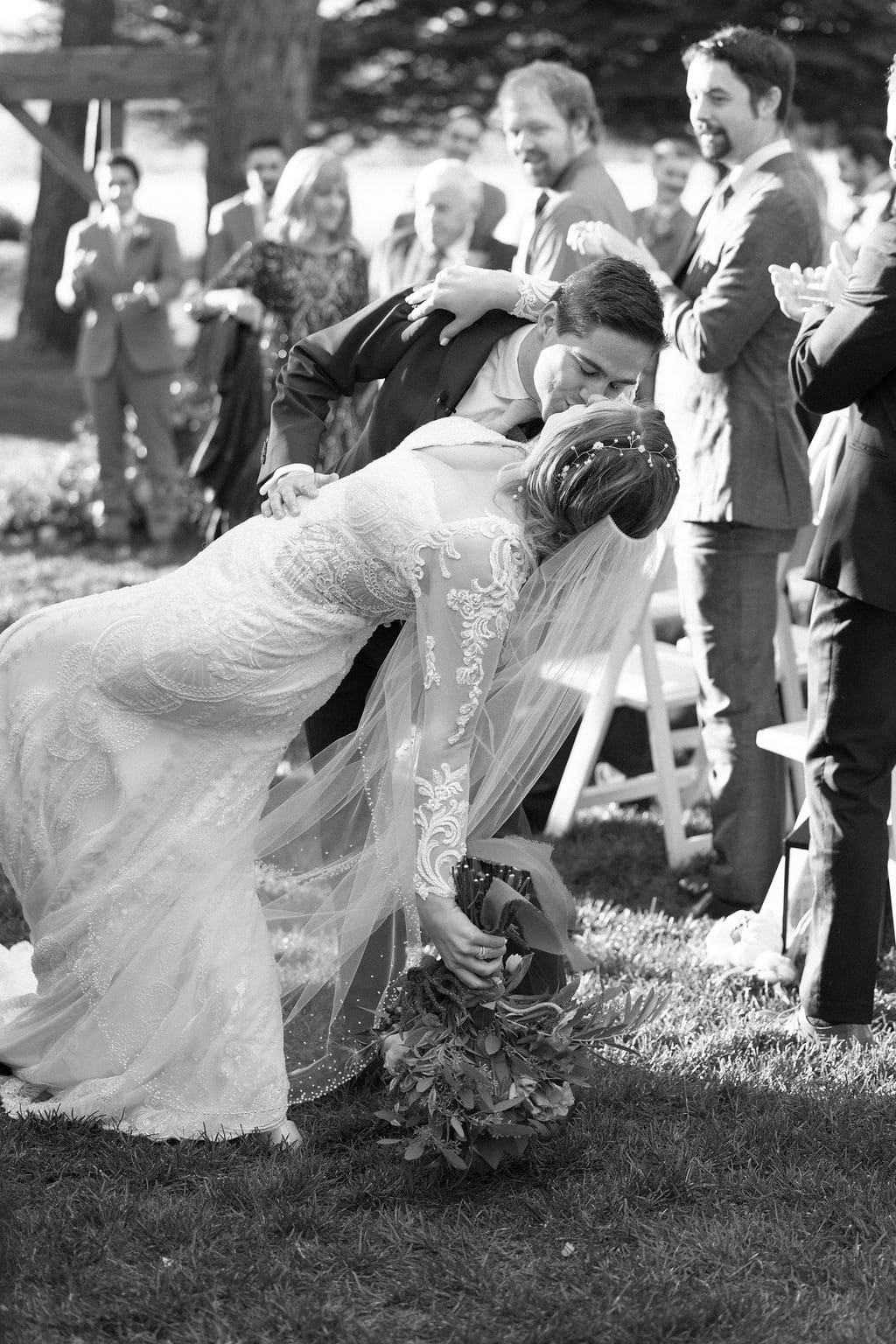Romantic Kiss from couple as they walk down the aisle after their wedding ceremony at Shupe Homestead