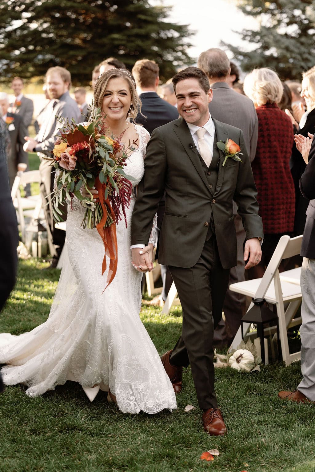 Just Married walking down the aisle together as husband and wife
