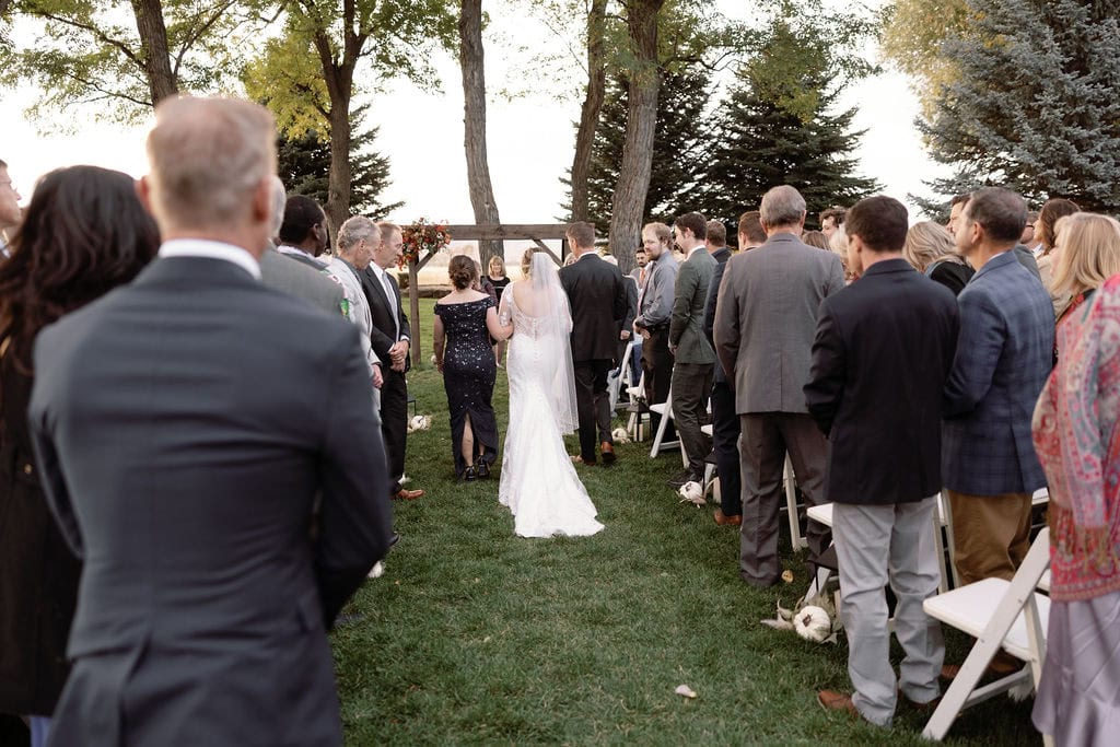 Beautiful fall wedding ceremony at shupe homestead boulder wedding venue