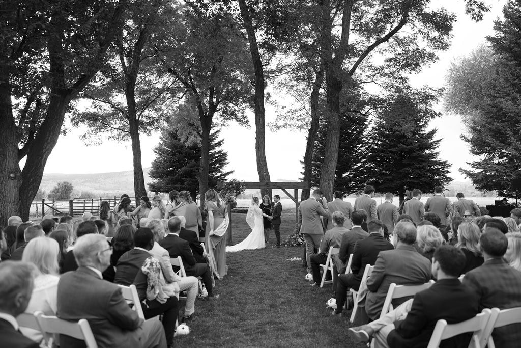 Gorgeous black and white photo of shupe homestead wedding ceremony in the fall