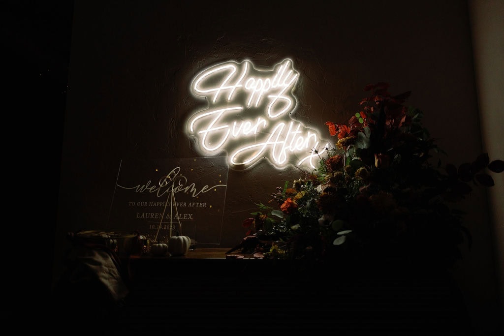 Shupe Homestead wedding reception set up. Light up sign that says Happily Ever After