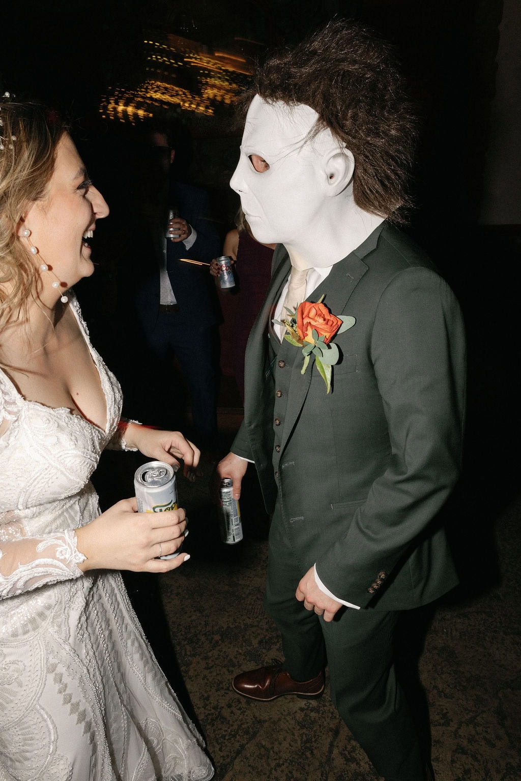 Groom puts on a mike myers mask and dances with his bride at their october shupe homestead wedding