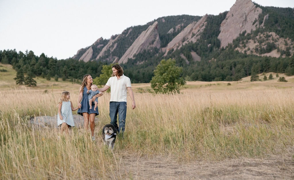 family walks together at their Family photo session at chautauqua park in boulder 