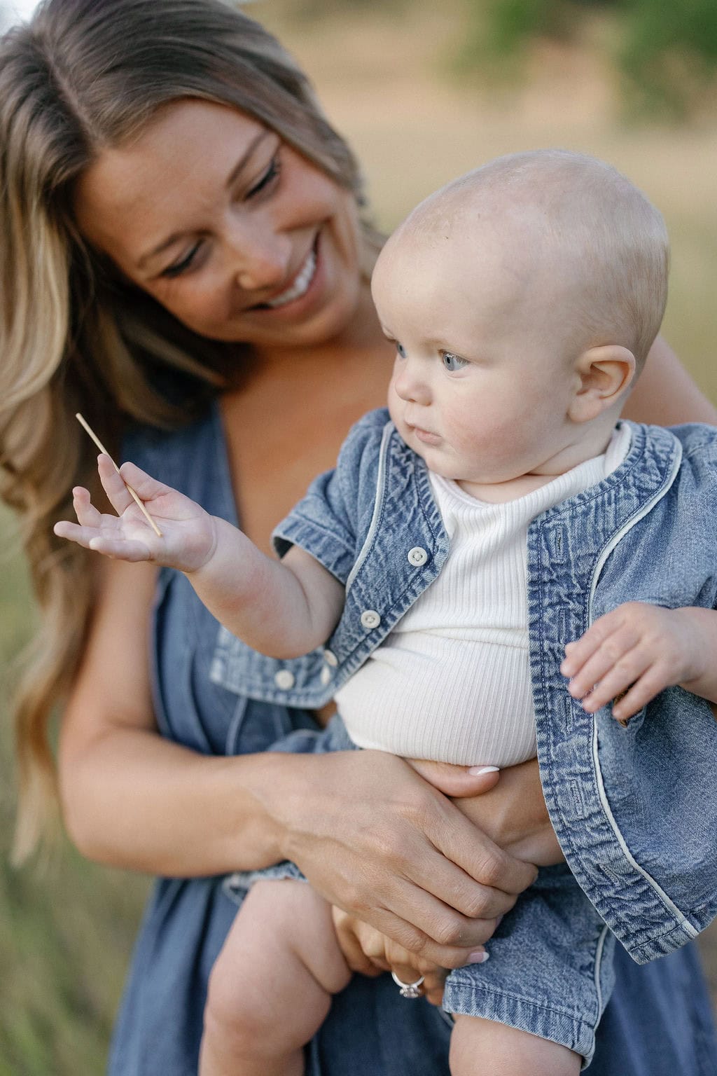 mom snuggles her baby at her Family photo session at chautauqua park in boulder 