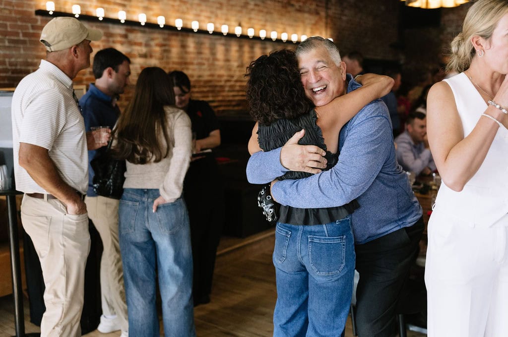 Fun and Joyous candid moments from a wedding welcome party at The Rose in Golden, Colorado