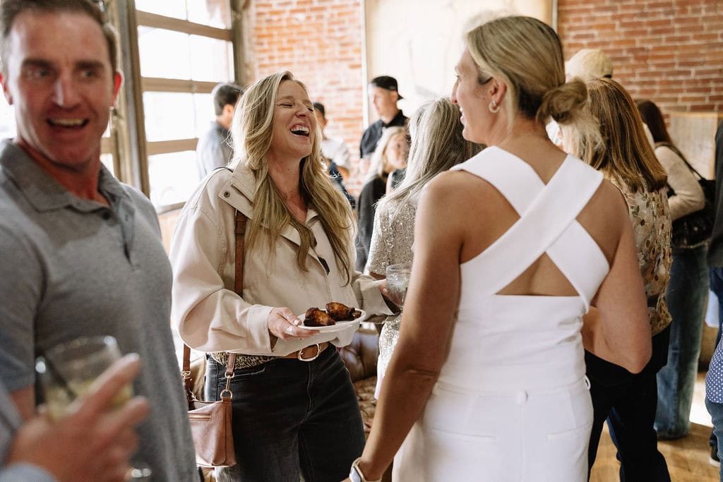 Fun and Joyous candid moments from a wedding welcome party at The Rose in Golden, Colorado