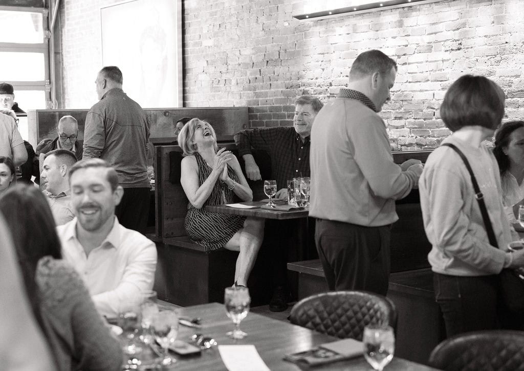 Fun and Joyous candid moments from a wedding welcome party at The Rose in Golden, Colorado