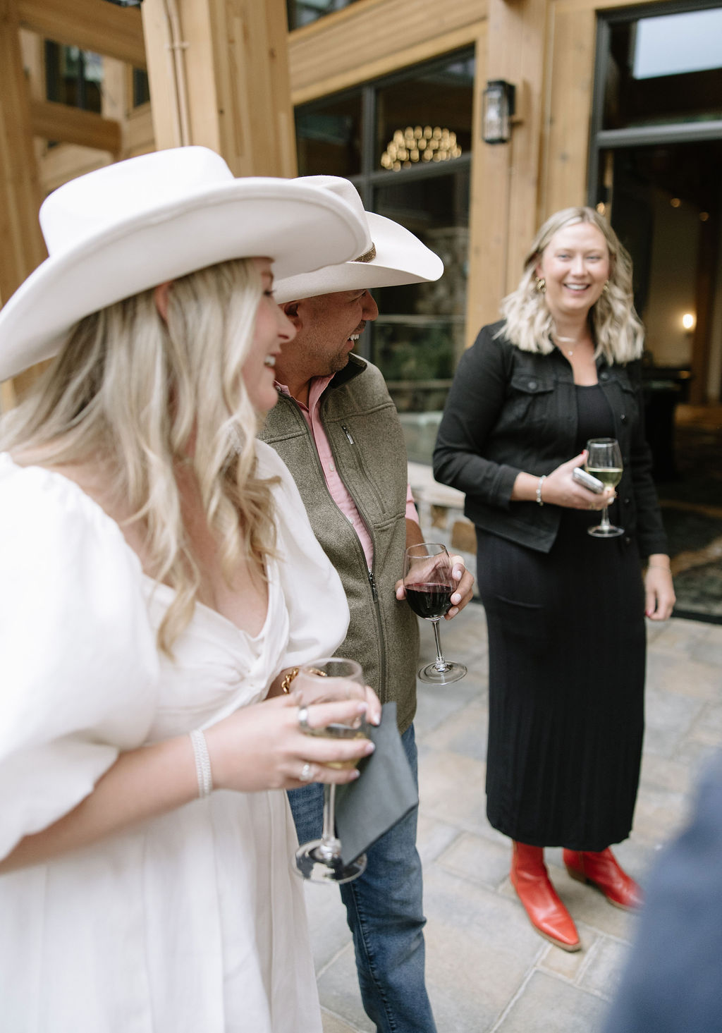 guests mingle at Wedding welcome party on the back patio at Kindred Resort in Keystone Colorado. 