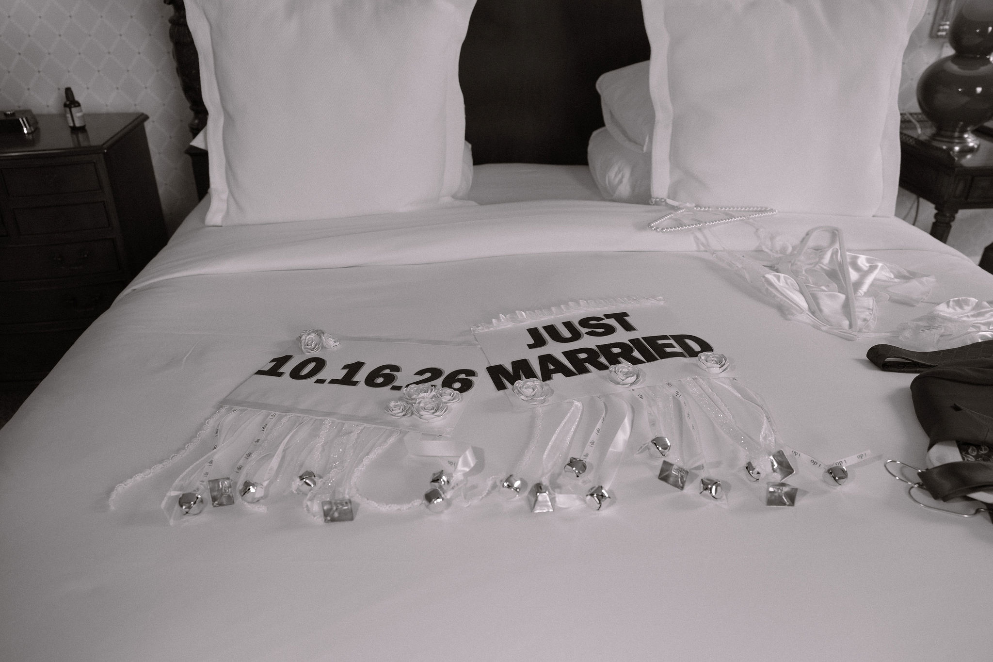 Just married signs sitting on a bed at the capital hotel in little rock