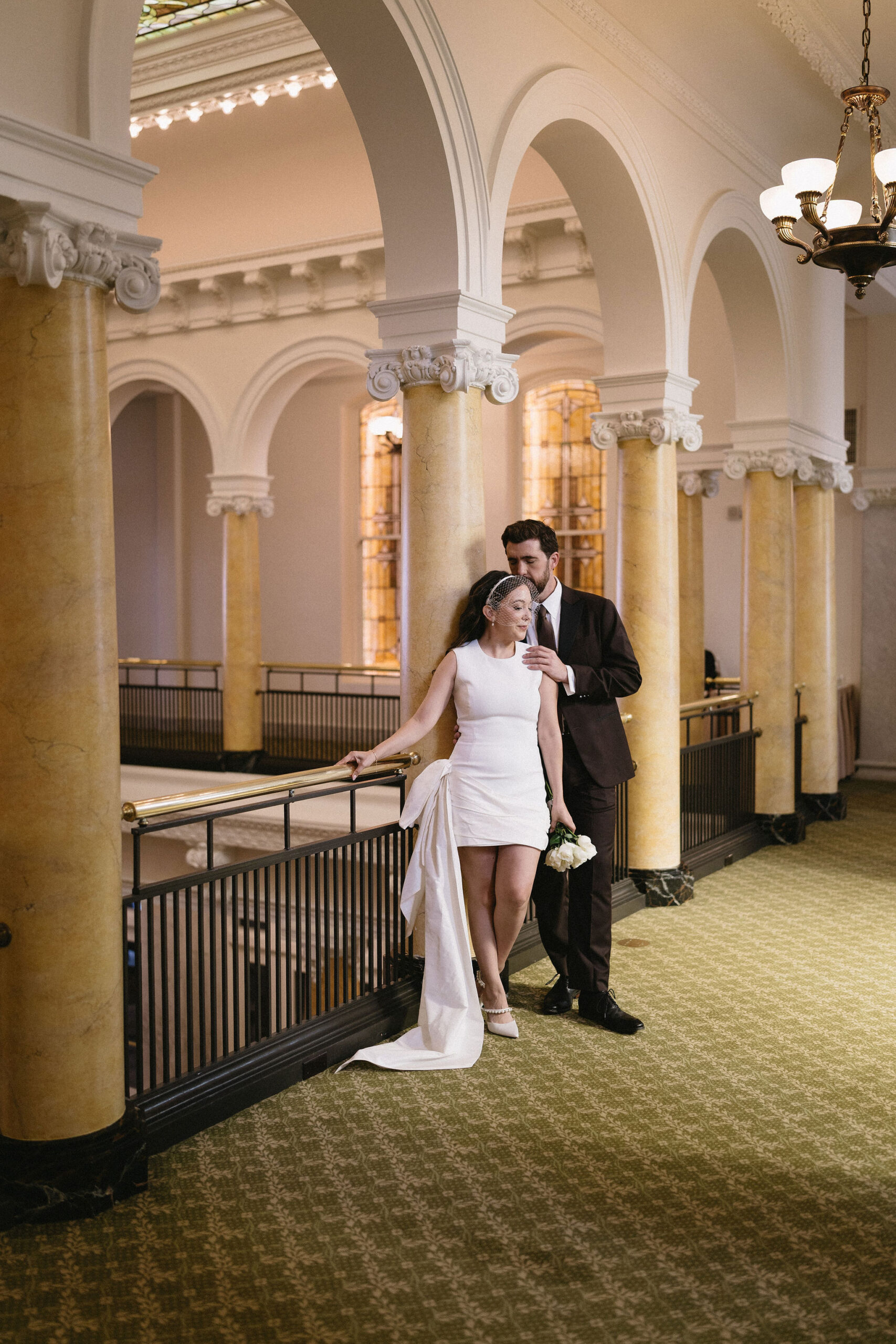 Wedding Portraits at The Capital Hotel in Little Rock Arkansas. Bride wears a bird cage veil.
