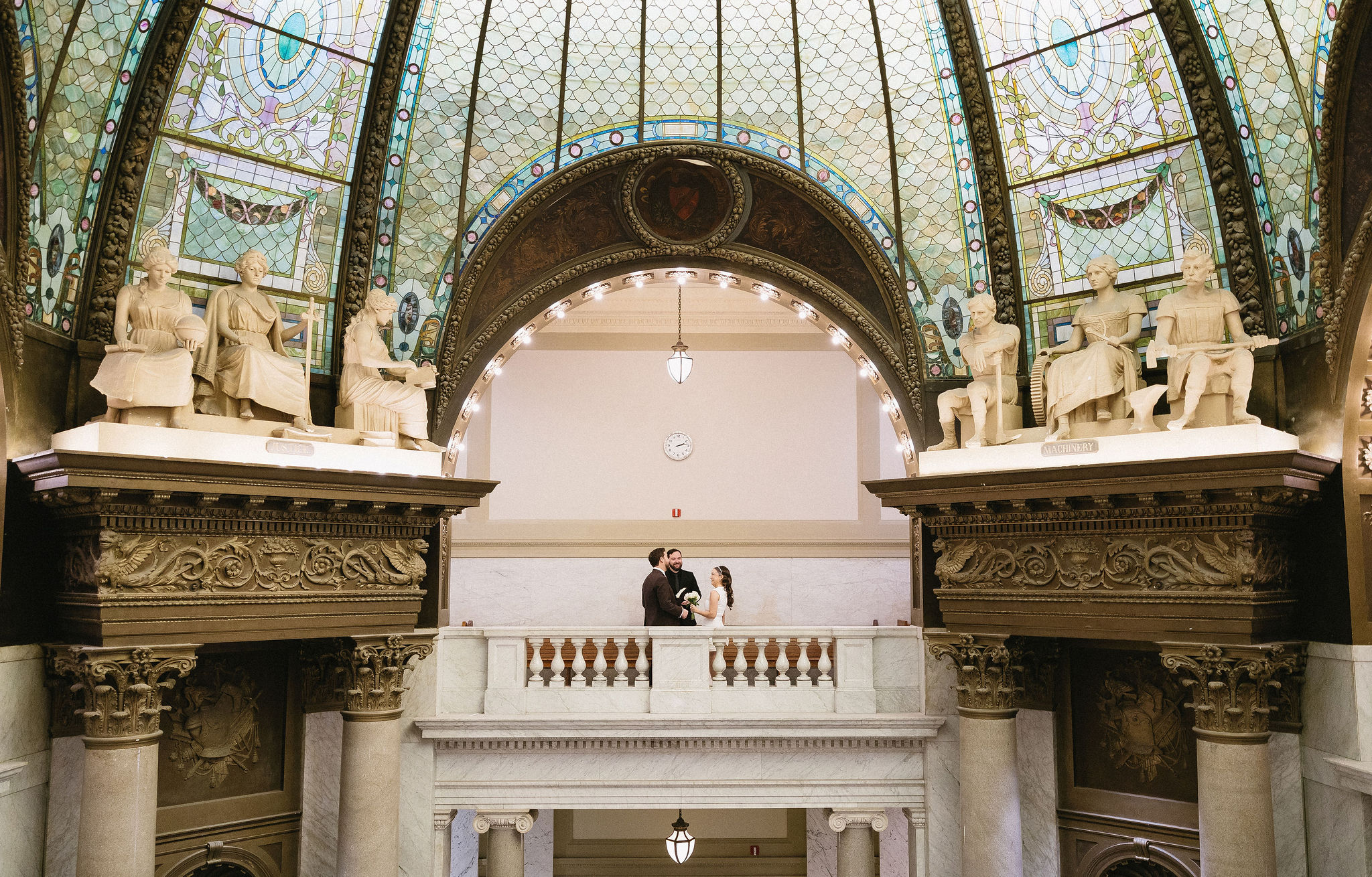 Stunning little rock courthouse wedding ceremony under stained glass dome. 