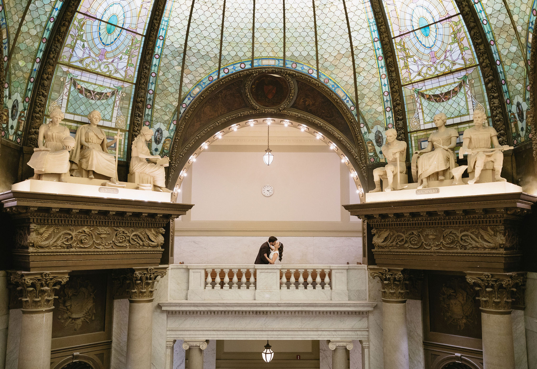Stunning little rock courthouse wedding ceremony under stained glass dome. 