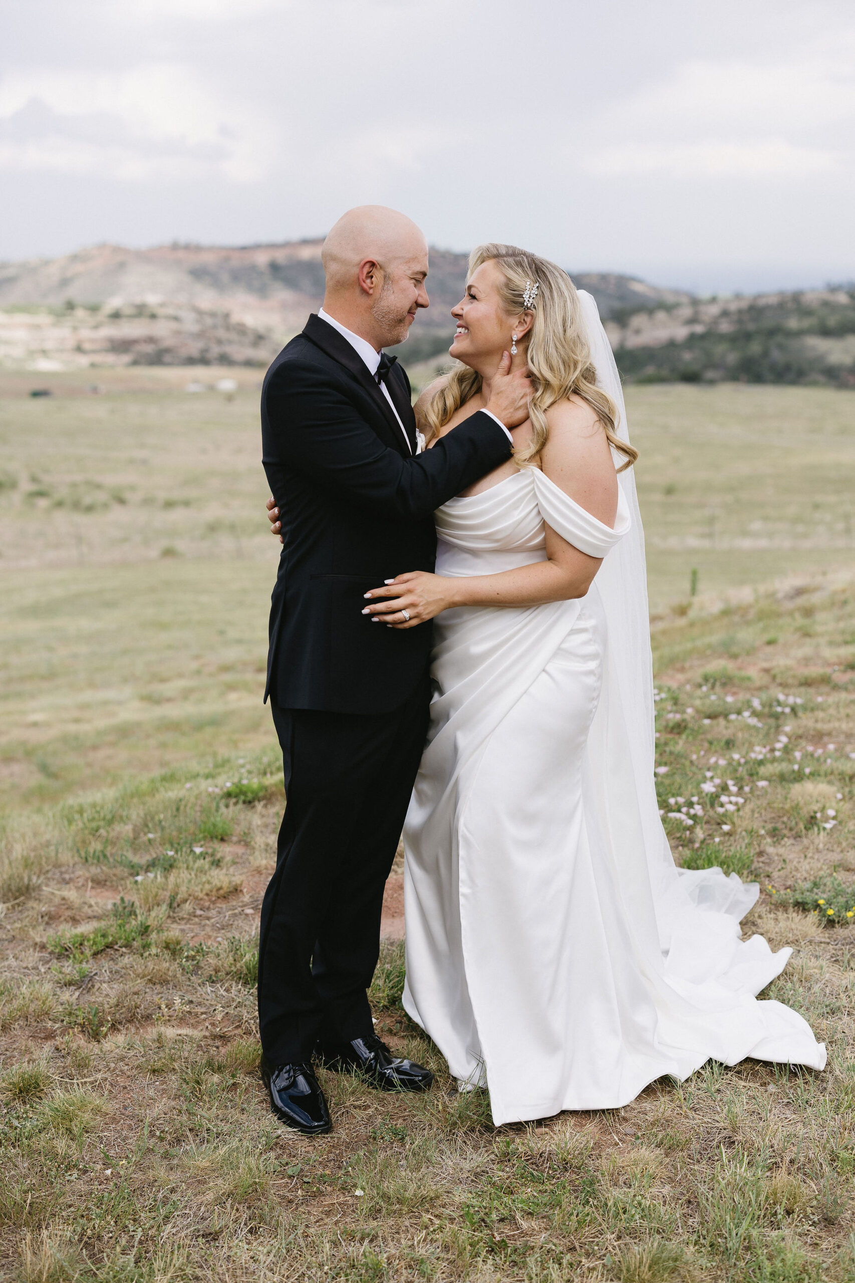 Bride and groom romantic and classy portraits in the bright Colorado sunshine at The Fort Restaurant in Morrison, CO.